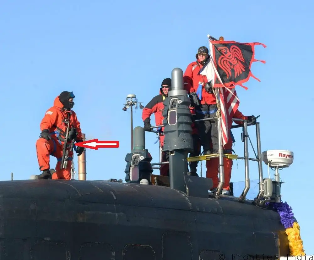 US Navy Attack Submarine USS Minnesota personnel holding portable laser dazzler gun