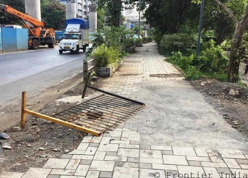 Powai Lake Pavement with broken iron fence