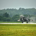 story cover -IAF Rafale aircraft touching down at Air Force Station Hasimara during the induction ceremony on 28 Jul 21