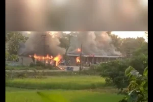 A screenshot from a viral video allegedly shot in Panisagar showing a Muslim shop on fire