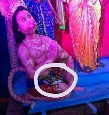 Image of Islamic Quaran on the lap of Hindu god Hanuman which led to the Hindu - Muslim riots. 