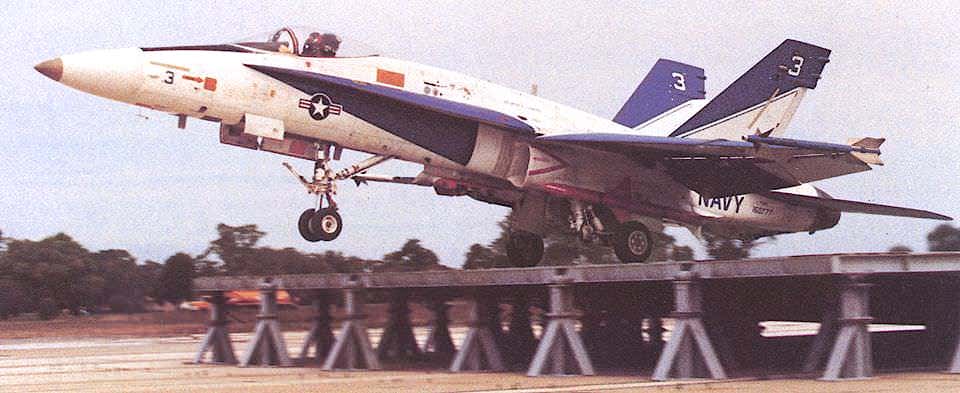 An F/A-18A Hornet takes off from a ground-based ski jump during a test in the late 1980s.