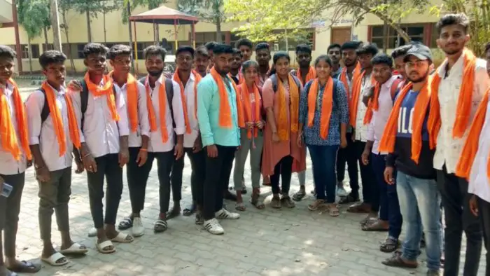 Indian students wear saffron scarves in protest against wearing hijab in school. 