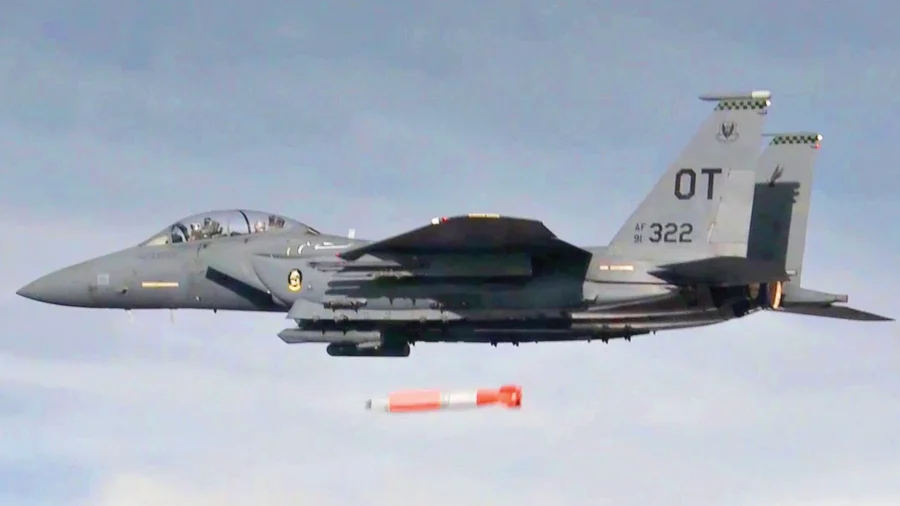 An F-15E drops a B61-12 test unit during a development flight test