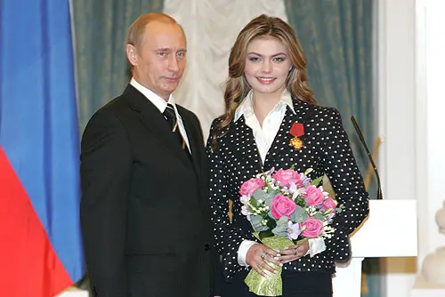 Russian President Vladimir Putin presents Alina Kabaeva with the Order of Merit for the Fatherland, IV degree, December 21, 2005