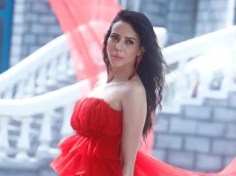 Rozlyn Khan in a red dress