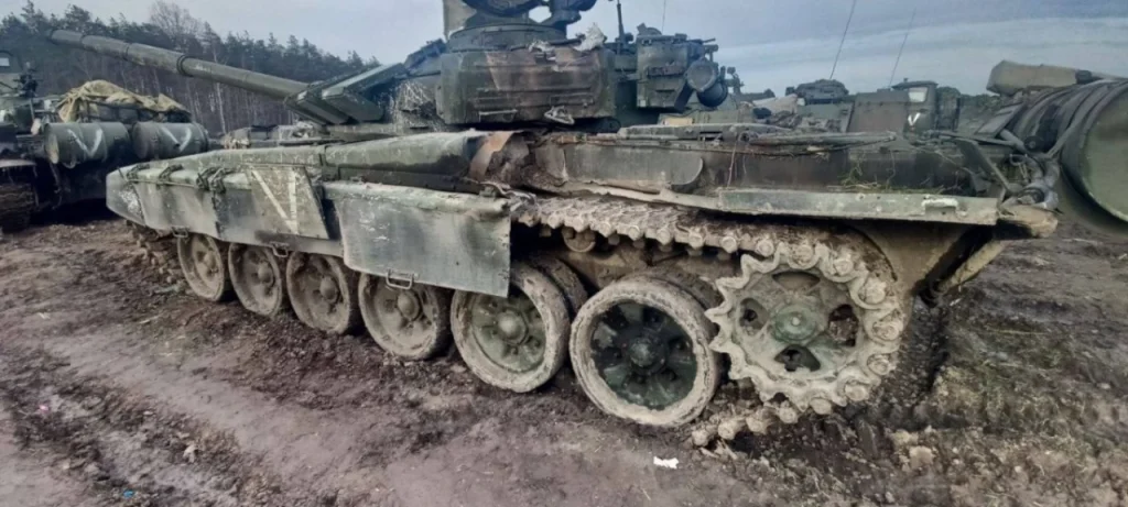 Full side view of T-72B Tank with multiple hits
