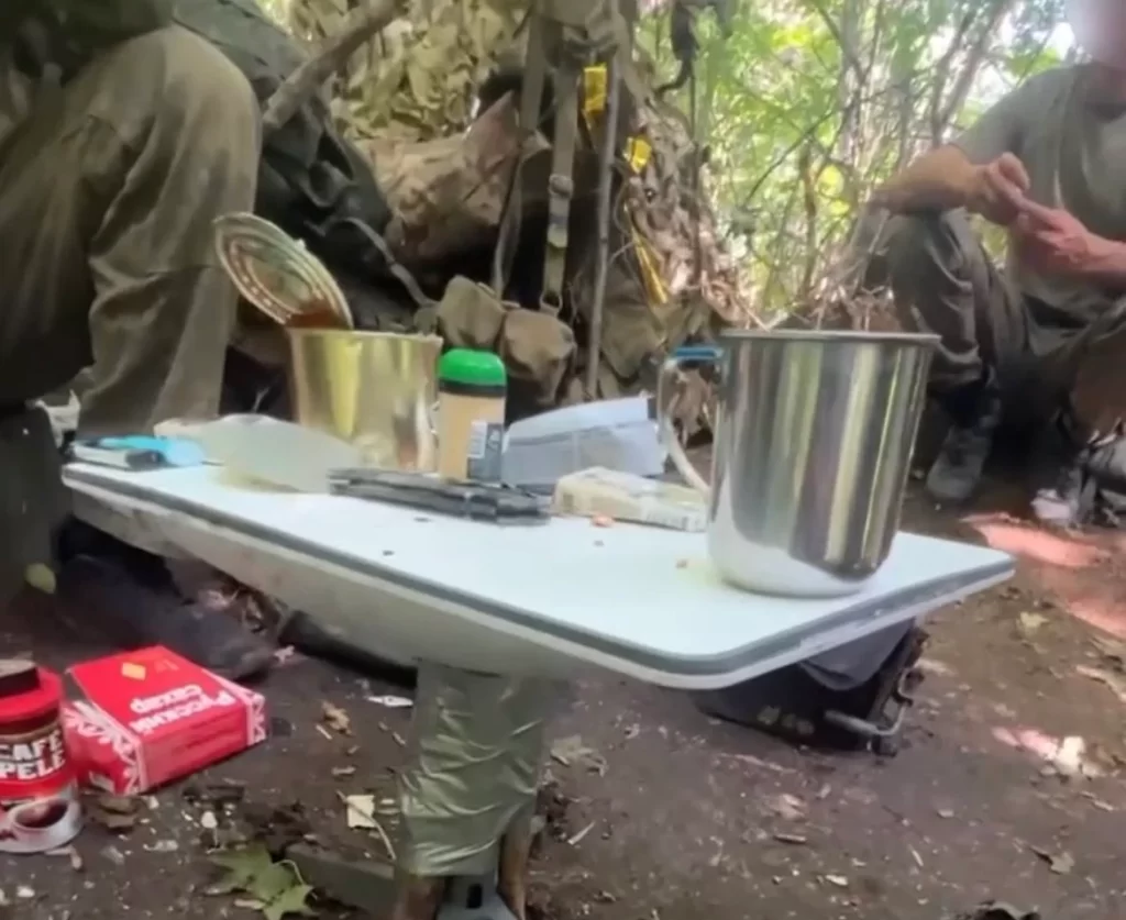 Russian Troops using Starlink Receivers captured from Ukraine as a dining table