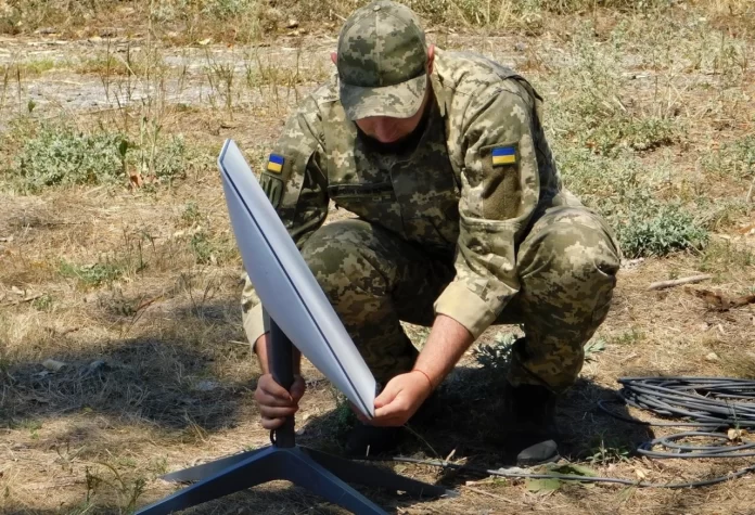 Ukrainian Soldier Installing Starlink Terminal