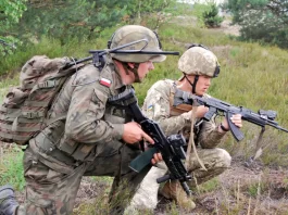 Ukrainian Soldier with an AK-74 and NATO soldier with M16.