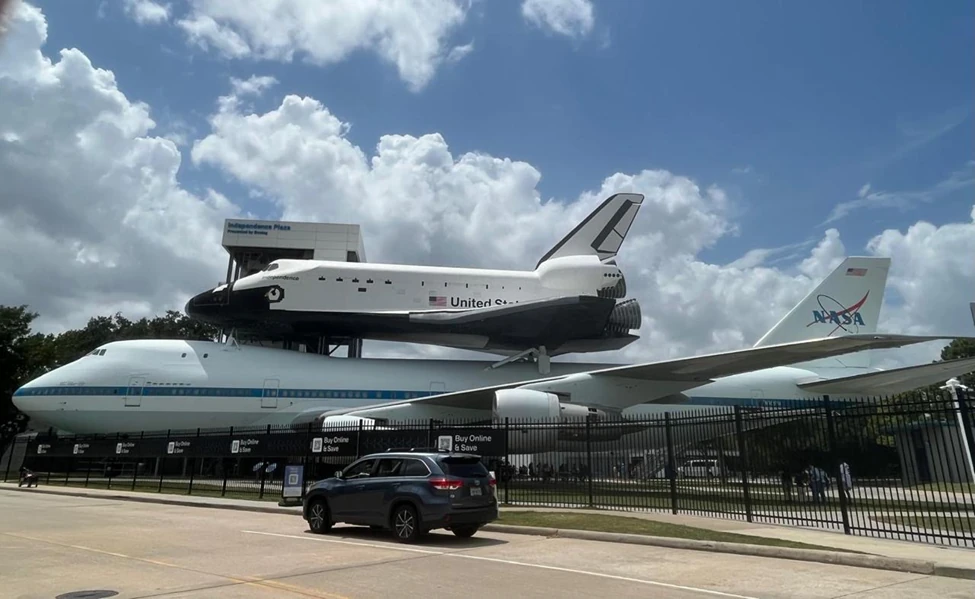 Space Shuttle The Independence flying-in atop a giant plane at Houston airport for its final destination in NASA Clear River.