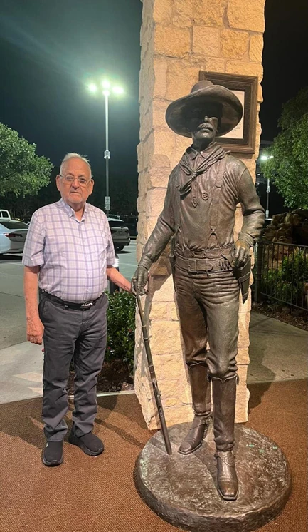 The entrance at the Taste of Texas Restaurant with a cowboy Statue.