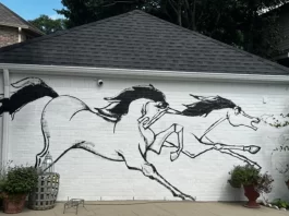Wild horses screaming across a 30 ft x 12 ft wall, providing a perfect backdrop to the scenic view of a pool.