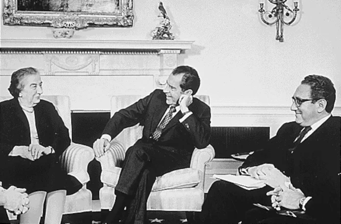 Kissinger sits in the Oval Office with President Nixon and Israeli prime minister Golda Meir, 1973