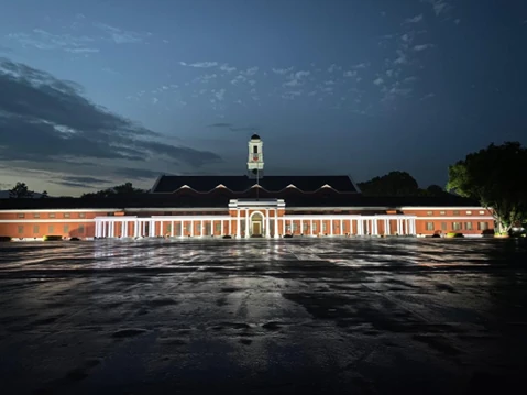 The Chetwode Building at IMA in Dehradun, lit up at night.